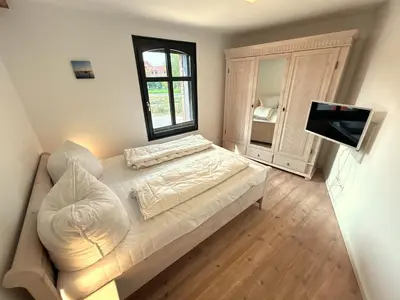 Ein Bett oder Betten in einem Zimmer der Unterkunft FEWO Sonnenschein 1,7