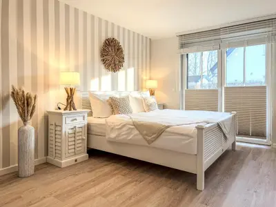 Ein Bett oder Betten in einem Zimmer der Unterkunft Schatzkiste Whg 2