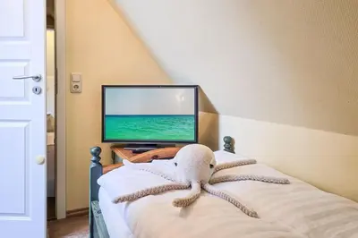 Ein Bett oder Betten in einem Zimmer der Unterkunft Seeluft