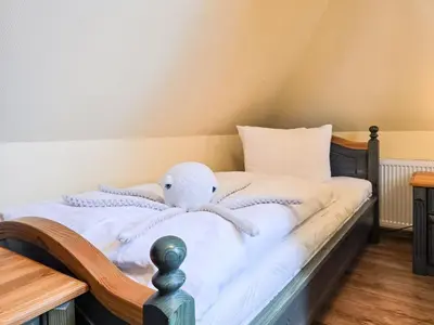 Ein Bett oder Betten in einem Zimmer der Unterkunft Seeluft