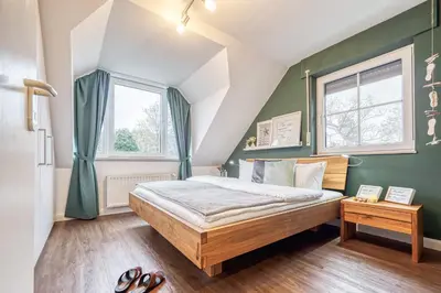 Ein Bett oder Betten in einem Zimmer der Unterkunft Haus Seeblick Whg 8