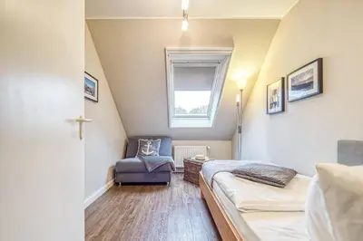 Ein Bett oder Betten in einem Zimmer der Unterkunft Haus Seeblick Whg 8