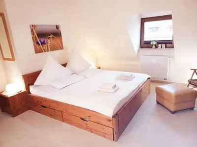 Ein Bett oder Betten in einem Zimmer der Unterkunft Maisonette Ferienwohnung - Stuth Barth