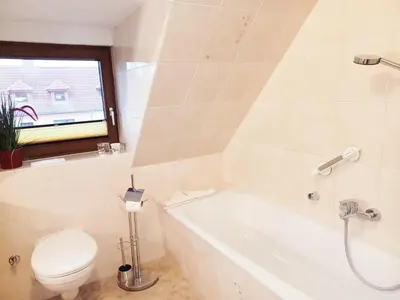 Ein Badezimmer in der Unterkunft Maisonette Ferienwohnung - Stuth Barth