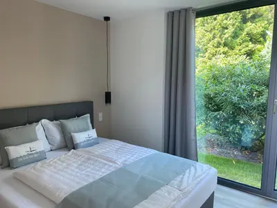 Ein Bett oder Betten in einem Zimmer der Unterkunft Happynest
