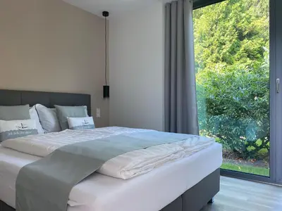 Ein Bett oder Betten in einem Zimmer der Unterkunft Happynest
