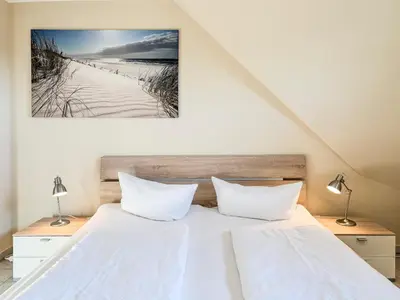 Ein Bett oder Betten in einem Zimmer der Unterkunft Schifferkaten
