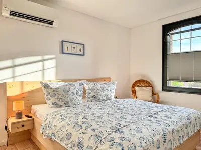 Ein Bett oder Betten in einem Zimmer der Unterkunft Speicherresidenz App 3 11 - Südseite