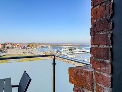 Ein Balkon oder eine Terrasse in der Unterkunft Speicherresidenz App 4 6 - Hafenblick
