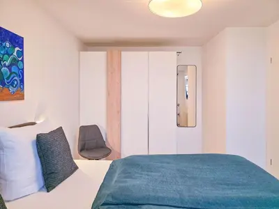 Ein Bett oder Betten in einem Zimmer der Unterkunft Speicherresidenz App 4 7 - Hafenblick