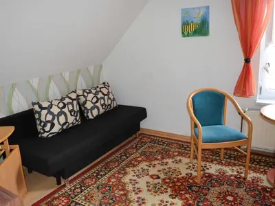 Ein Sitzbereich in der Unterkunft Ferienwohnung auf dem Lande
