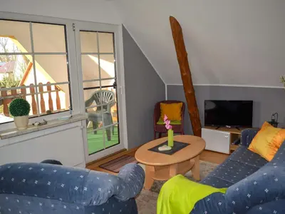 Ein Sitzbereich in der Unterkunft Ferienwohnung auf dem Lande