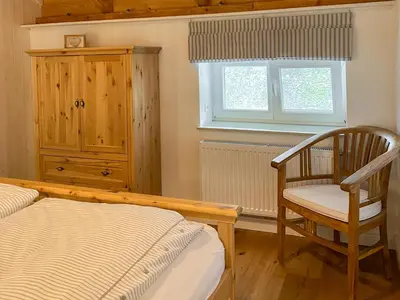 Ein Bett oder Betten in einem Zimmer der Unterkunft Wattmanbruukt