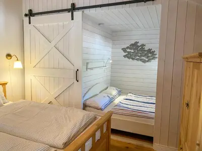 Ein Bett oder Betten in einem Zimmer der Unterkunft Wattmanbruukt
