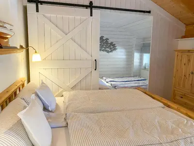 Ein Bett oder Betten in einem Zimmer der Unterkunft Wattmanbruukt