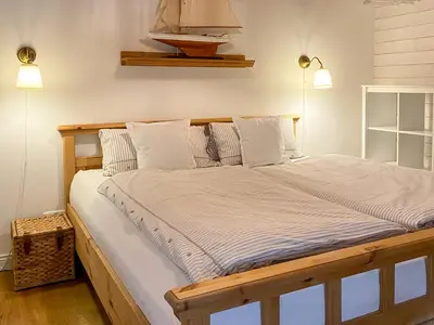 Ein Bett oder Betten in einem Zimmer der Unterkunft Wattmanbruukt