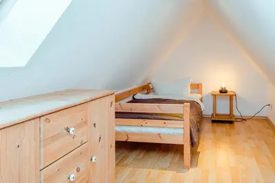 Ein Bett oder Betten in einem Zimmer der Unterkunft Ferienhaus Sanddorn, Fewo Strandflieder