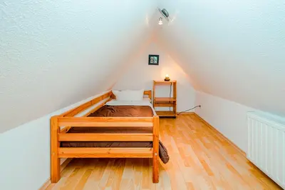 Ein Bett oder Betten in einem Zimmer der Unterkunft Ferienhaus Sanddorn, Fewo Strandflieder