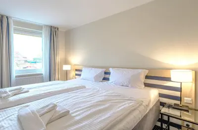 Ein Bett oder Betten in einem Zimmer der Unterkunft Deichblick - gemütliches Apartment im Herzen von Zingst