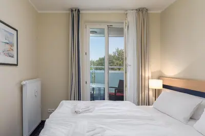 Ein Bett oder Betten in einem Zimmer der Unterkunft Seestern - Charmante 2-Zimmer-Wohnung mit Balkon