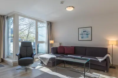 Ein Sitzbereich in der Unterkunft Ostseeanker - stilvolles Apartment in Strandnähe