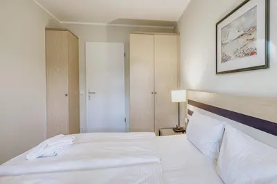 Ein Bett oder Betten in einem Zimmer der Unterkunft Ostseeanker - stilvolles Apartment in Strandnähe