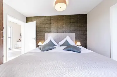 Ein Bett oder Betten in einem Zimmer der Unterkunft 5 Sterne Ferienwohnung Sommersuite mit genialer Dachterrasse