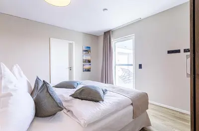 Ein Bett oder Betten in einem Zimmer der Unterkunft 5 Sterne Ferienwohnung Sommersuite mit genialer Dachterrasse
