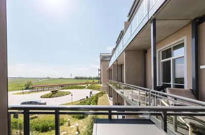 Ein Balkon oder eine Terrasse in der Unterkunft Moderne 5 Sterne Ferienwohnung Welleneck im malerischen Ostseebad Wustrow