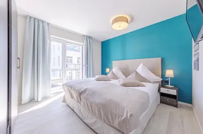 Ein Bett oder Betten in einem Zimmer der Unterkunft 5 Sterne Ferienwohnung Große Strandperle für ihren Urlaub zwischen Ostsee und Bodden
