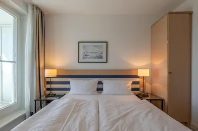 Ein Bett oder Betten in einem Zimmer der Unterkunft Sturmmöwe - Ferienwohnung direkt an der Ostsee gelegen