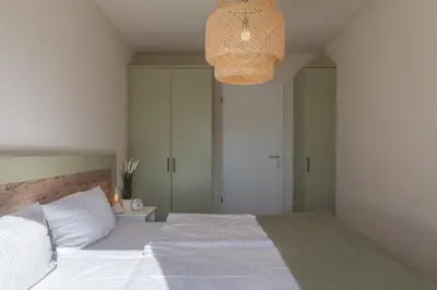 Ein Bett oder Betten in einem Zimmer der Unterkunft Küstenglück - Ferienwohnung im 1Obergeschoss mit Balkon