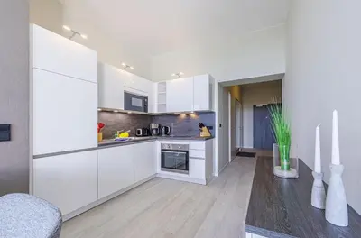 Küche/Küchenzeile in der Unterkunft Ostseeperle - 5-Sterne-Ferienwohnung für den perfekten Wellnessurlaub mit Blick auf den Bodden