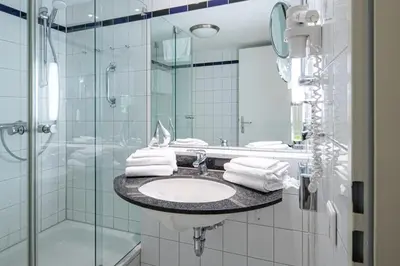 Ein Badezimmer in der Unterkunft Grasnelke - Ferienwohnung mit Terrasse zum Kurpark im Ostseeheilbad Zingst