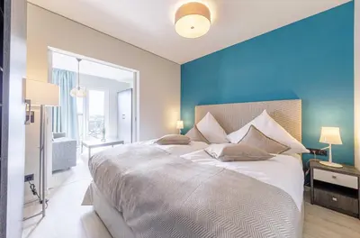 Ein Bett oder Betten in einem Zimmer der Unterkunft Sommerbrise - 5 Sterne Ferienwohnung für die ganze Familie im Ostseebad Wustrow
