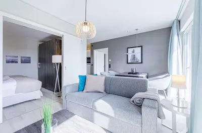 Ein Bett oder Betten in einem Zimmer der Unterkunft Sommerbrise - 5 Sterne Ferienwohnung für die ganze Familie im Ostseebad Wustrow