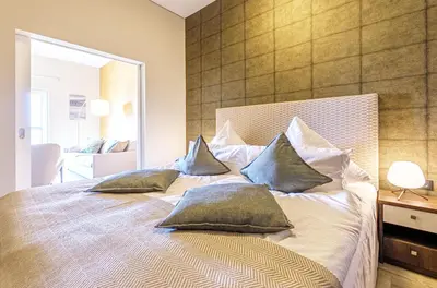 Ein Bett oder Betten in einem Zimmer der Unterkunft Ankerplatz - 5 Sterne Ferienwohnung mit Blick auf die Ostsee