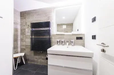 Ein Badezimmer in der Unterkunft Sommerblume - 5 Sterne Ferienwohnung mit Blick über die Dünen zur Ostsee
