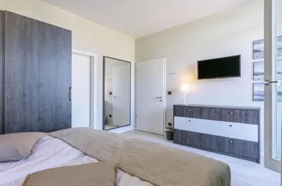 Ein Bett oder Betten in einem Zimmer der Unterkunft Backboard - Haustierfreundliche Ferienwohnung mit Nordbalkon für bis zu 3 Personen