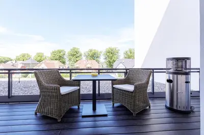 Ein Balkon oder eine Terrasse in der Unterkunft First Garden View - Ihre Ferienwohnung im Ostseebad Wustrow