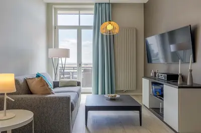 TV/Unterhaltungsangebot in der Unterkunft Sandwelle 5 Sterne Apartment mit Boddenblick