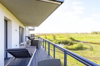 Ein Balkon oder eine Terrasse in der Unterkunft Strandläufer 5 Sterne-Ferienwohnung mit Komfort, Wellness & Ostseeblick