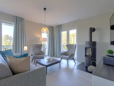 Ein Sitzbereich in der Unterkunft Strandläufer 5 Sterne-Ferienwohnung mit Komfort, Wellness & Ostseeblick
