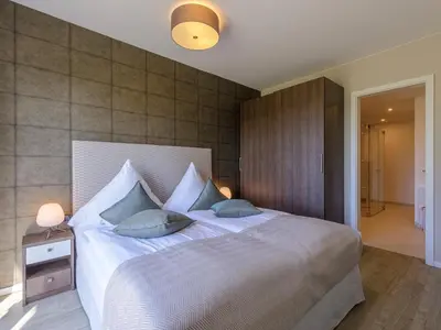 Ein Bett oder Betten in einem Zimmer der Unterkunft 5 Sterne Ferienwohnung Strandidylle mit großer Terrasse