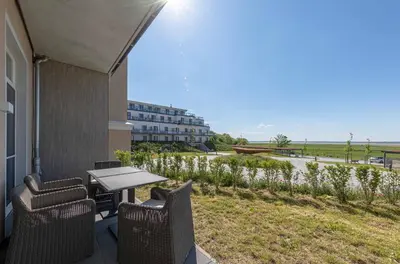 Ein Balkon oder eine Terrasse in der Unterkunft Moderne 5 Sterne Ferienwohnung Strandlilie