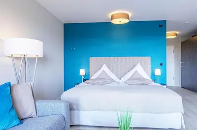 Ein Bett oder Betten in einem Zimmer der Unterkunft Kleine Strandmuschel mit Südbalkon