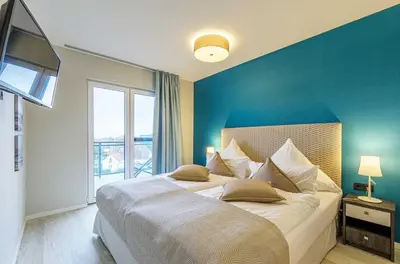 Ein Bett oder Betten in einem Zimmer der Unterkunft Sommerzeit- 3 Zimmer-Wohnung mit 5 Sternen