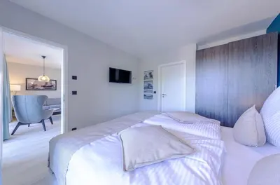 Ein Bett oder Betten in einem Zimmer der Unterkunft Strandluft - 5 Sterne Ferienwohnung mit Infrarotkabine