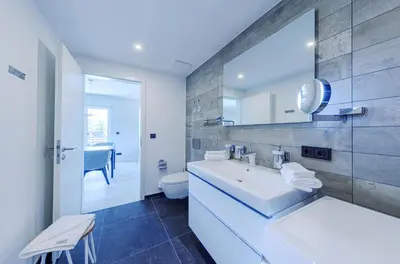 Ein Bett oder Betten in einem Zimmer der Unterkunft Strandluft - 5 Sterne Ferienwohnung mit Infrarotkabine