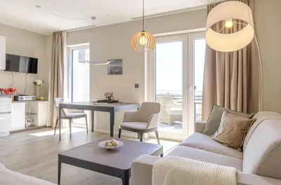 Ein Sitzbereich in der Unterkunft Kleine Strandoase - Ferienwohnung mit Südbalkon, Wellness & Boddenblick